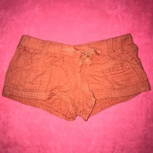 Orange cloth shorts.